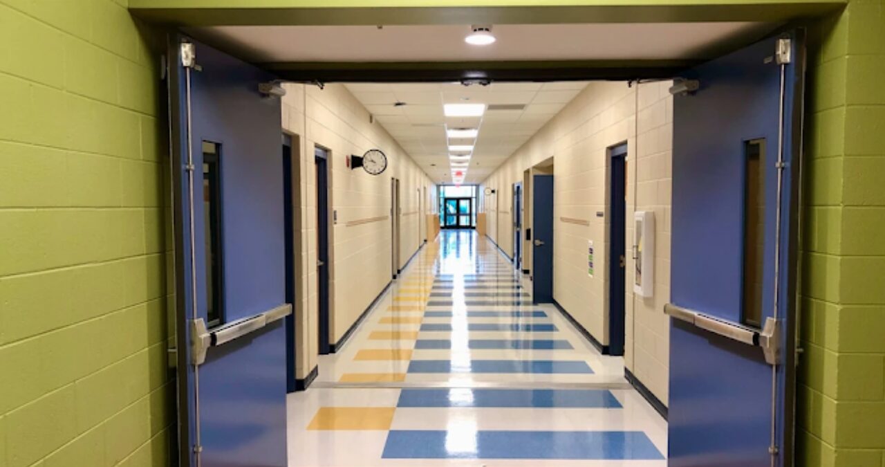 Decorative epoxy floor coating in a school hallway used to protect concrete floors and add a clean, polished look.