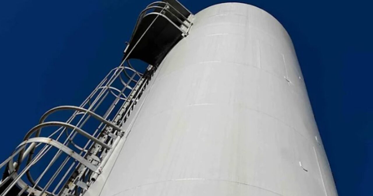 Freshly painted commercial storage tank with industrial-grade coating — Southeast Painters' commercial painting services.