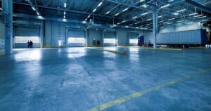 Clean warehouse loading area with no visible warehouse floor cracking.