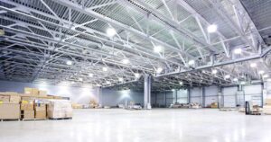 Warehouse Interior After Paint Renewal A professionally painted, clean, and bright warehouse interior, showing the transformation possible with a thorough Warehouse Paint Renewal.