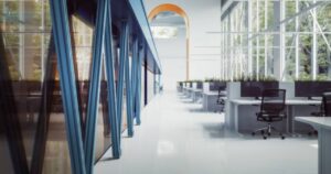 A bright, modern office space with clean white floors, showcasing a professionally installed resinous flooring system.