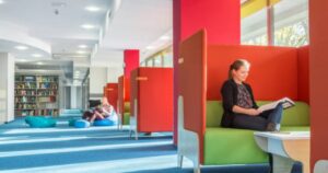 Modular study pods using orange and green to show how strategic Color for Your Commercial Space influences focus and mood.